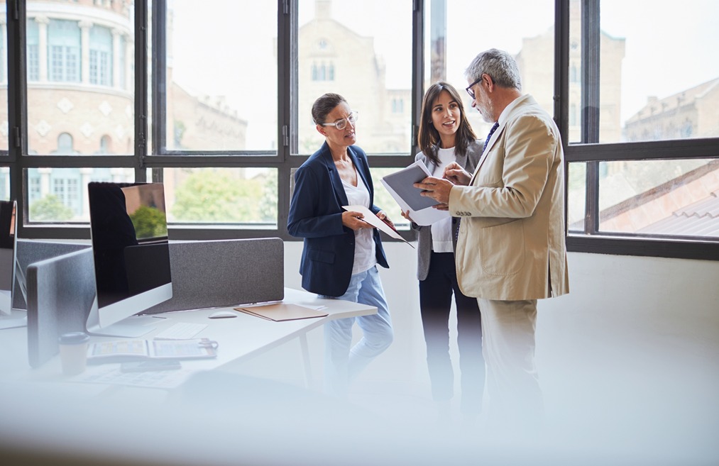 Commercial HVAC consultation with facility decision-makers reviewing service needs