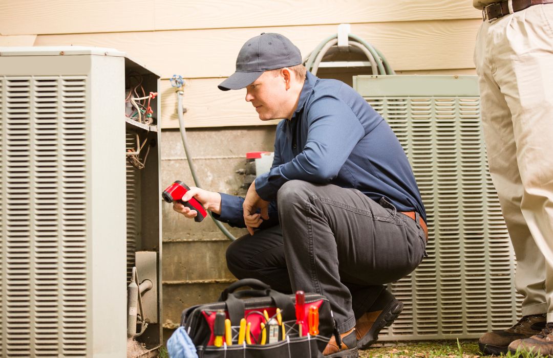 Technician inspecting a residential HVAC unit during home service visit