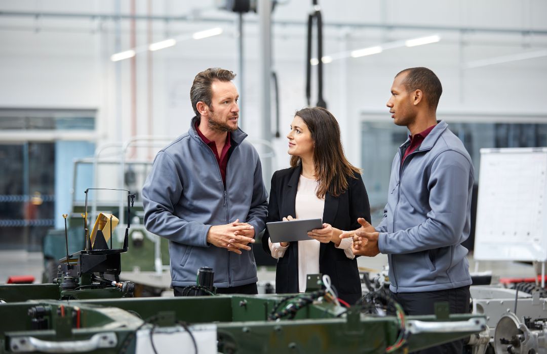 Commercial HVAC team discussing facility equipment and service planning on-site